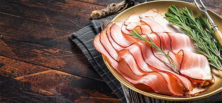 Smoked sliced bacon in wooden plate. 