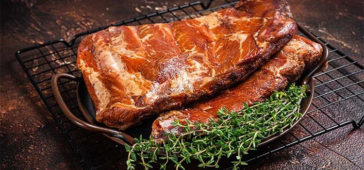 Grilled pork with herbs in a grilling tray