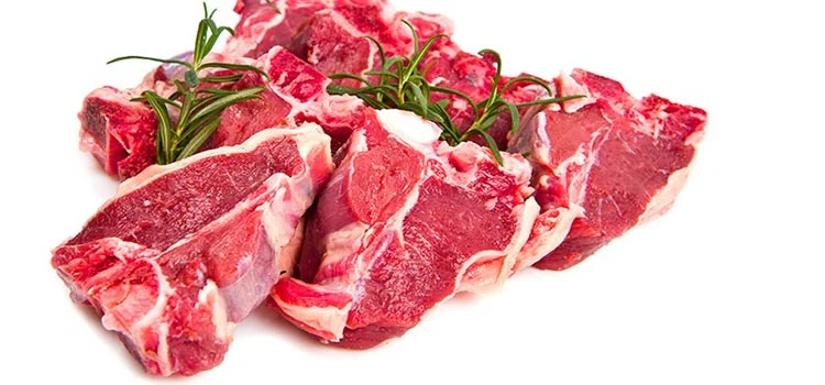 Raw lamb pieces with herbs