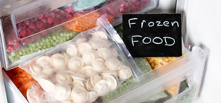Assortment of frozen vegetables and dumplings in the refrigerator