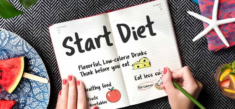 Woman creating diet chart plan on a notepad.