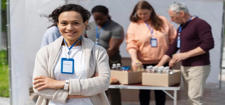 Close-up of group of different people volunteering at a food bank 