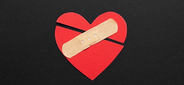  Close-up of broken heart with band-aid 