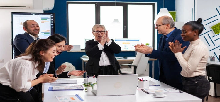 Close-up of diverse executive business team clapping in conference room 