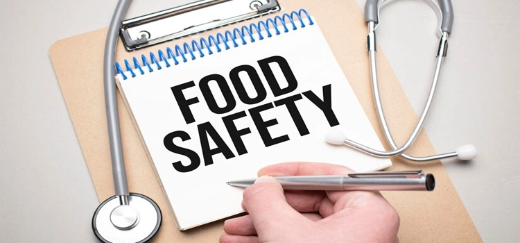 White notepad with the words food safety and a stethoscope